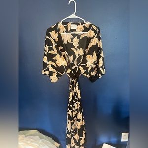 A beautiful black and tan floral silky robe.
